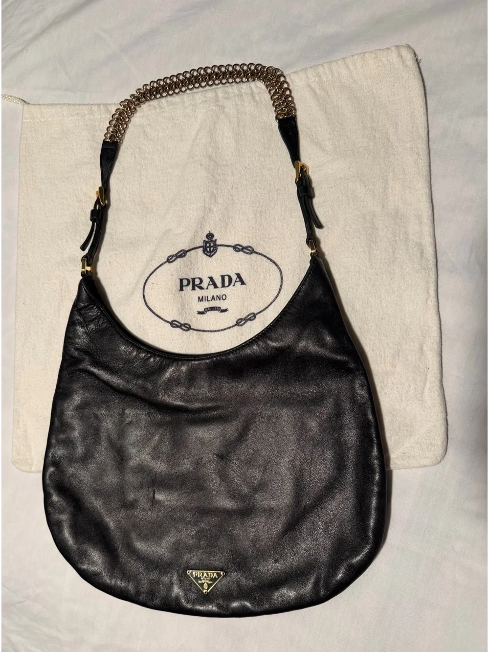 Prada Black Leather Hobo with Gold Chain Accent and dust bag .